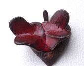 Red butterfly on a red heart . Wedding decoration, symbol of love.