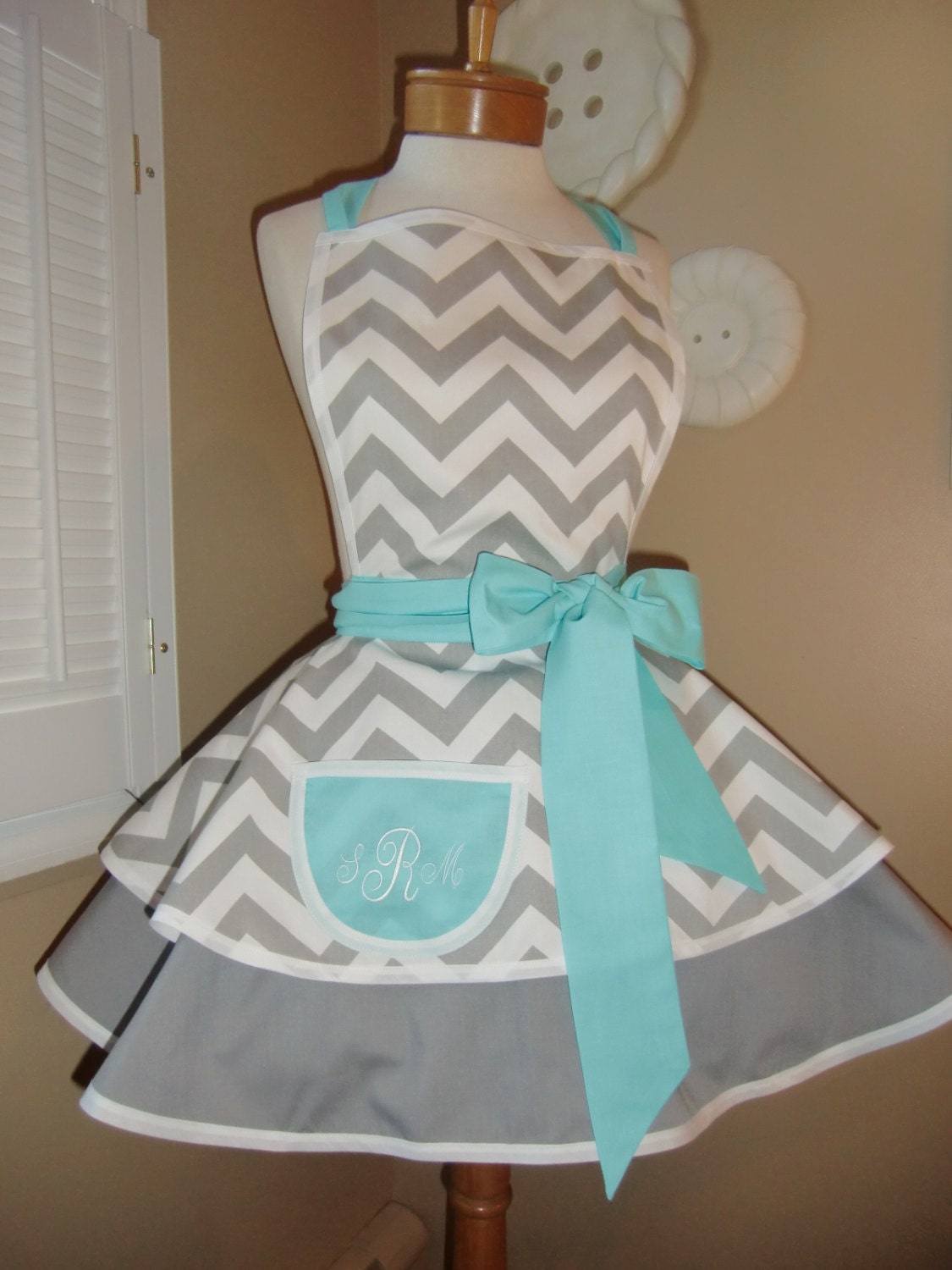 Chevron Print Accented with Aqua Blue Womans Retro Apron With Tiered Skirt And Bib, Featuring Monogrammed Pocket