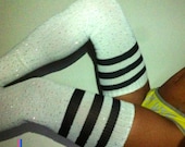 crystallized white thigh high socks with stripes.