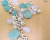 ON SALE Charm  necklace with pearls,opal glass,sea glass, turtles and shell  beads  on a chain,Handmade The Blue Lagoon.