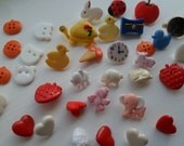 Totally random selection of 44 Vintage buttons including bears, hearts, birds and a hippo.