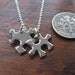 Two Miniature Puzzle Piece Pendants on one Necklace