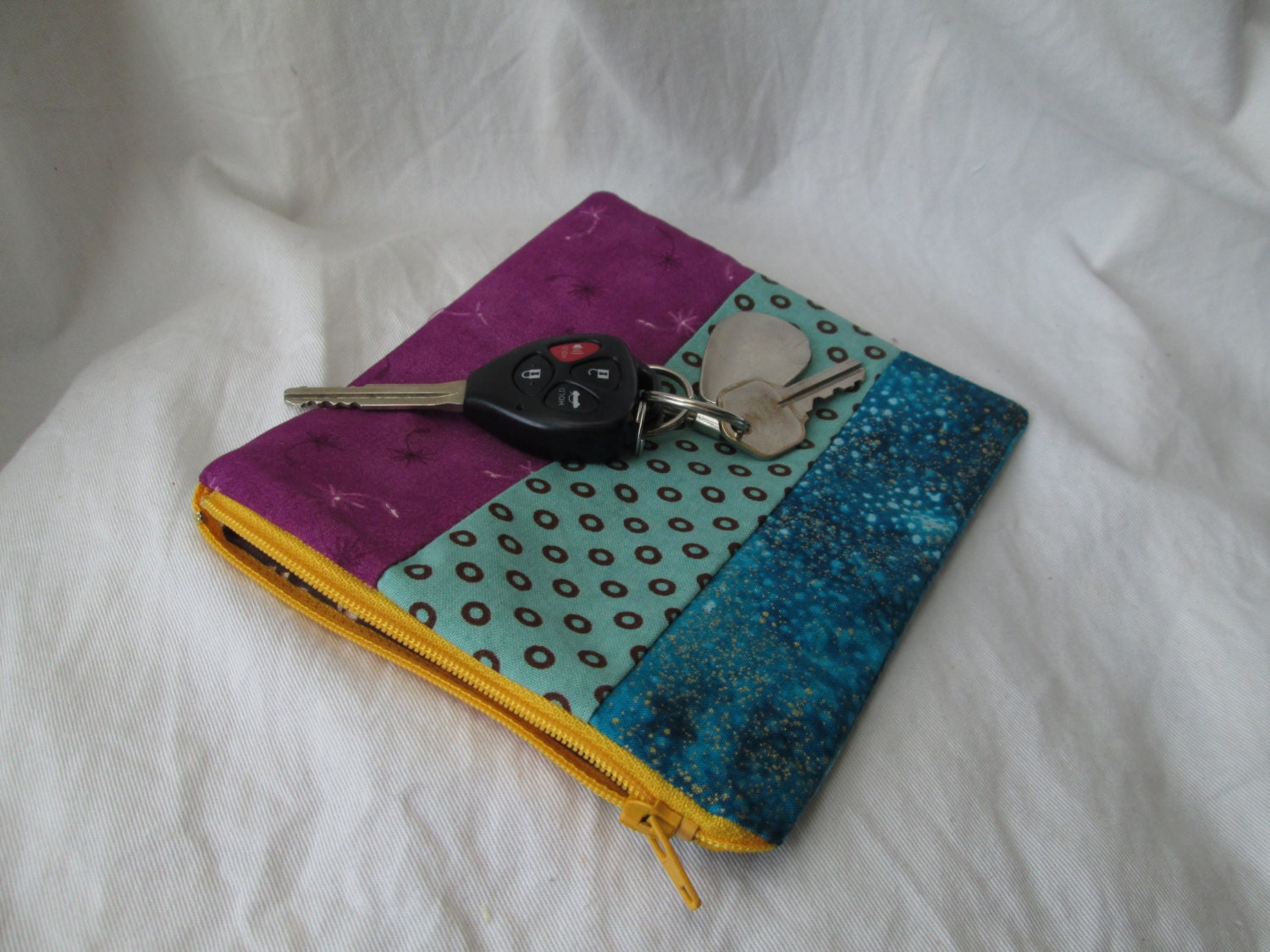 Yellow zippered multi patterned coin purse