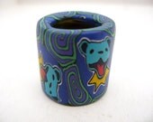 Big dreadlock bead, Grateful Dead dancing bear inspired, blue bear with yellow ruff and green and purple spirals