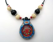Millefiori tribal pendant, polymer clay and glass, beautiful tribal patterns, with acai seed beads and spacers on thin cord, handmade