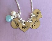 Hand stamped cluster names necklace with wire wrapped stone