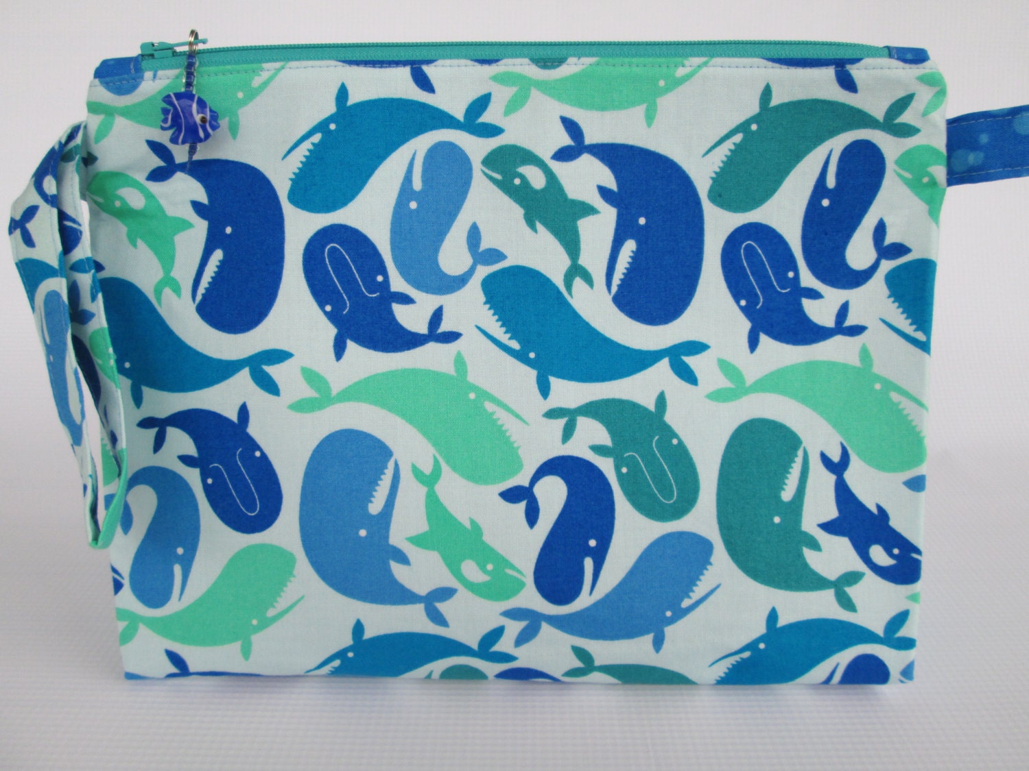 Medium Zippered Wedge Bag - Tossed Whales, with glass fish bead zipper pull