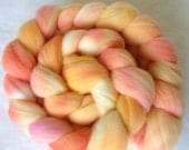 Hand dyed wool roving top in oranges, pinks and reds