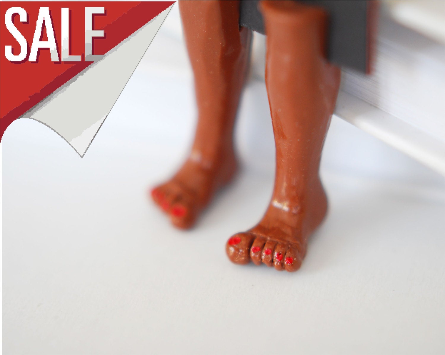 SALE. Bare women feet with dark skin. Unusual art bookmark with red nails.