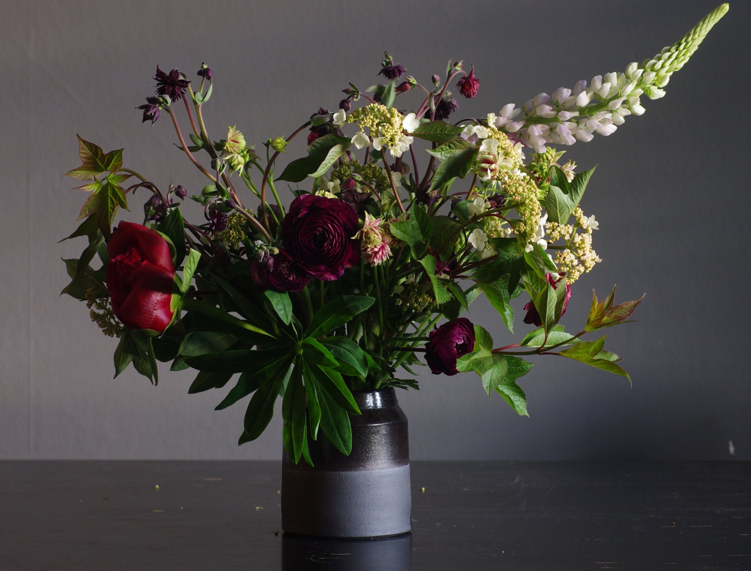 MTO black vase. black stoneware with white glaze. flower vase