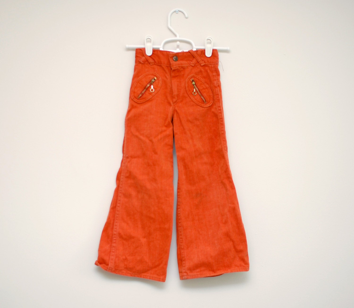 Vintage 1970s orange bell-bottom child's jeans