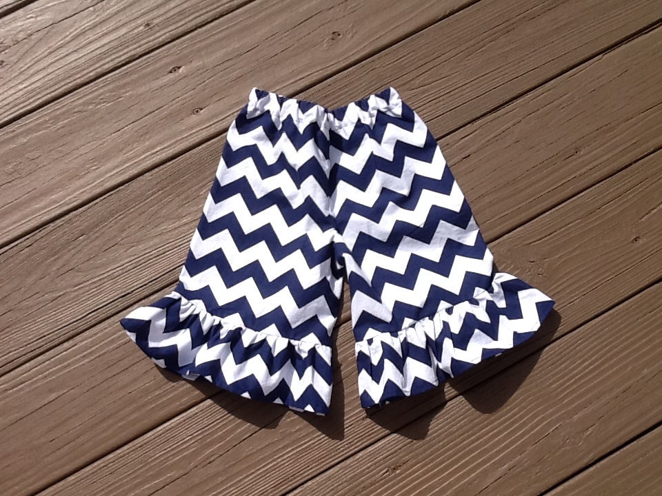Girls ruffle knee shorts, capris, or pants.  Navy blue white or any color chevron. Custom boutique children's clothing by EverythingSorella.