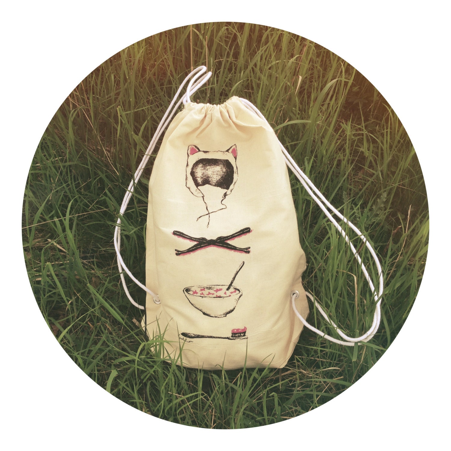 Screenprinted 'Morning items' illustration eco cotton drawstring backpack with stars, bobby pins, cat hat and breakfast illustration.