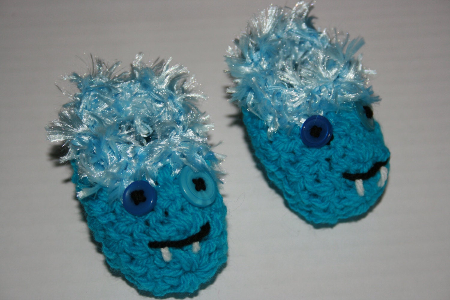 Crochet newborn baby booties, blue. Monster slippers.
