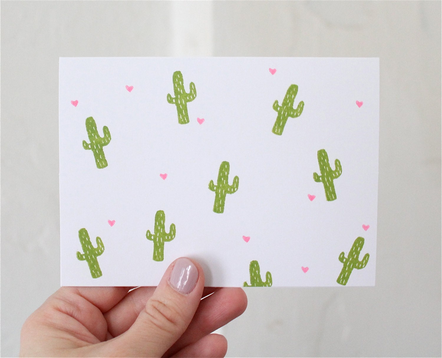 Blank card with cactus and tiny hearts pattern