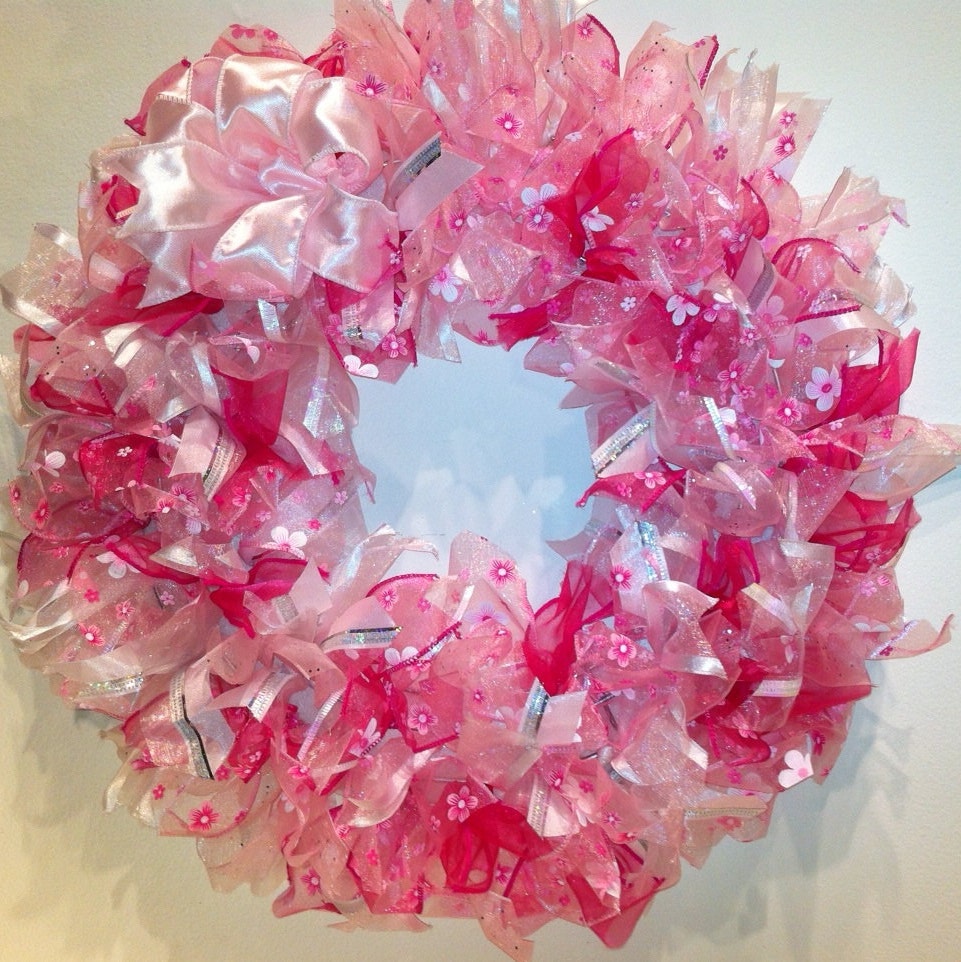 15 inch wreath made with pink wire edged ribbon.