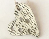 Metal handmade hearts earrings hammered and oxidized