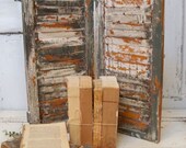 Wooden shutter distressed deep gray white accents farmhouse recycled wood wall sheld decor anita spero