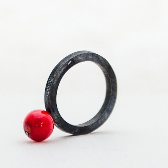 Silver ring with a coral bead