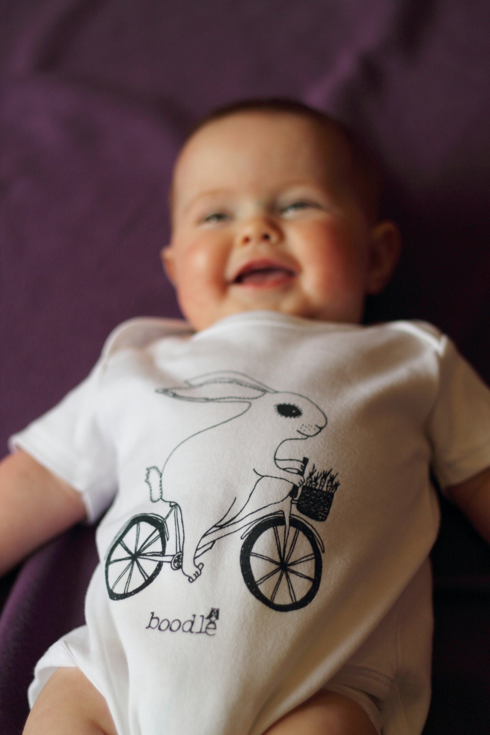 Rabbit Baby grow, hand screen printed on Organic cotton with eco-friendly inks. Bunny riding a bike