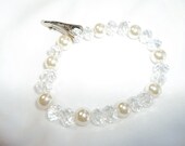 Warm-toned (cream) genuine Pearl and Crystal pattern( 2 crystal, 1 pearl) temple bracelet