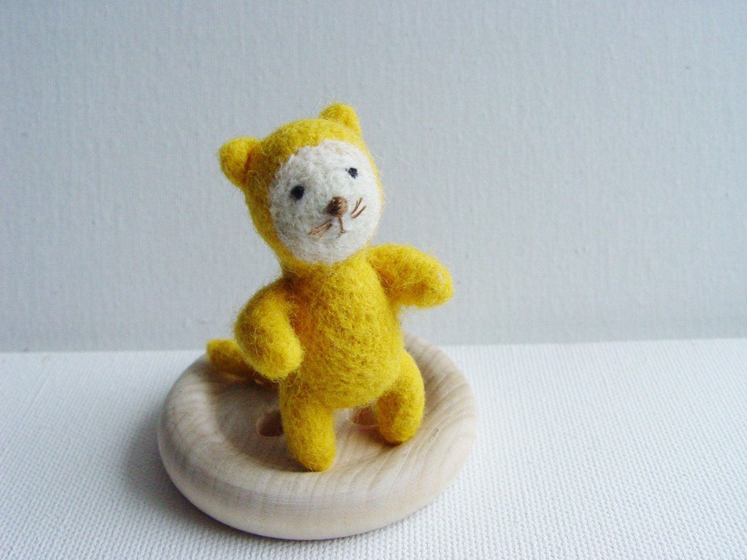 Yellow needle felted miniature cat toy