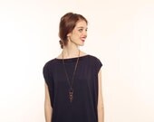 Long necklace dream-catcher style in brass sunbathes, Black, brown and turquoise blue.