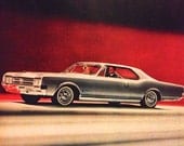 1965 Oldsmobile Ad - Starfire - Red and Black