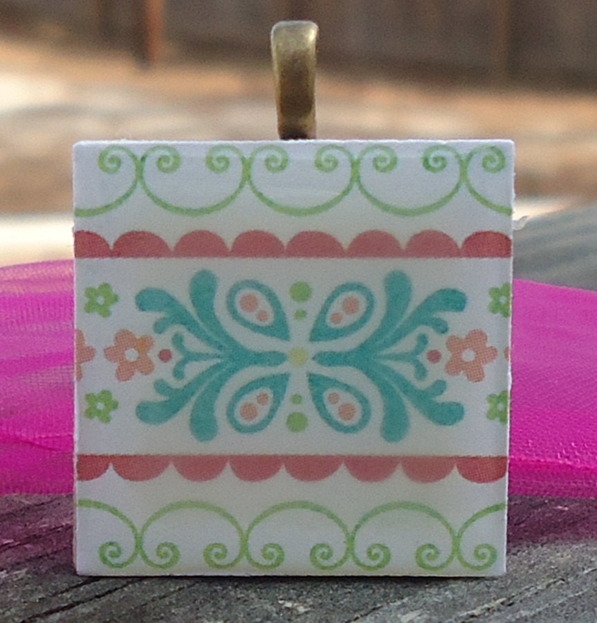 Patterned Necklace with Pretty Flowers Pastel Colors on Wood Tile