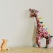 Jolly giraffe taggy tag animal baby toy with pink and red floral print