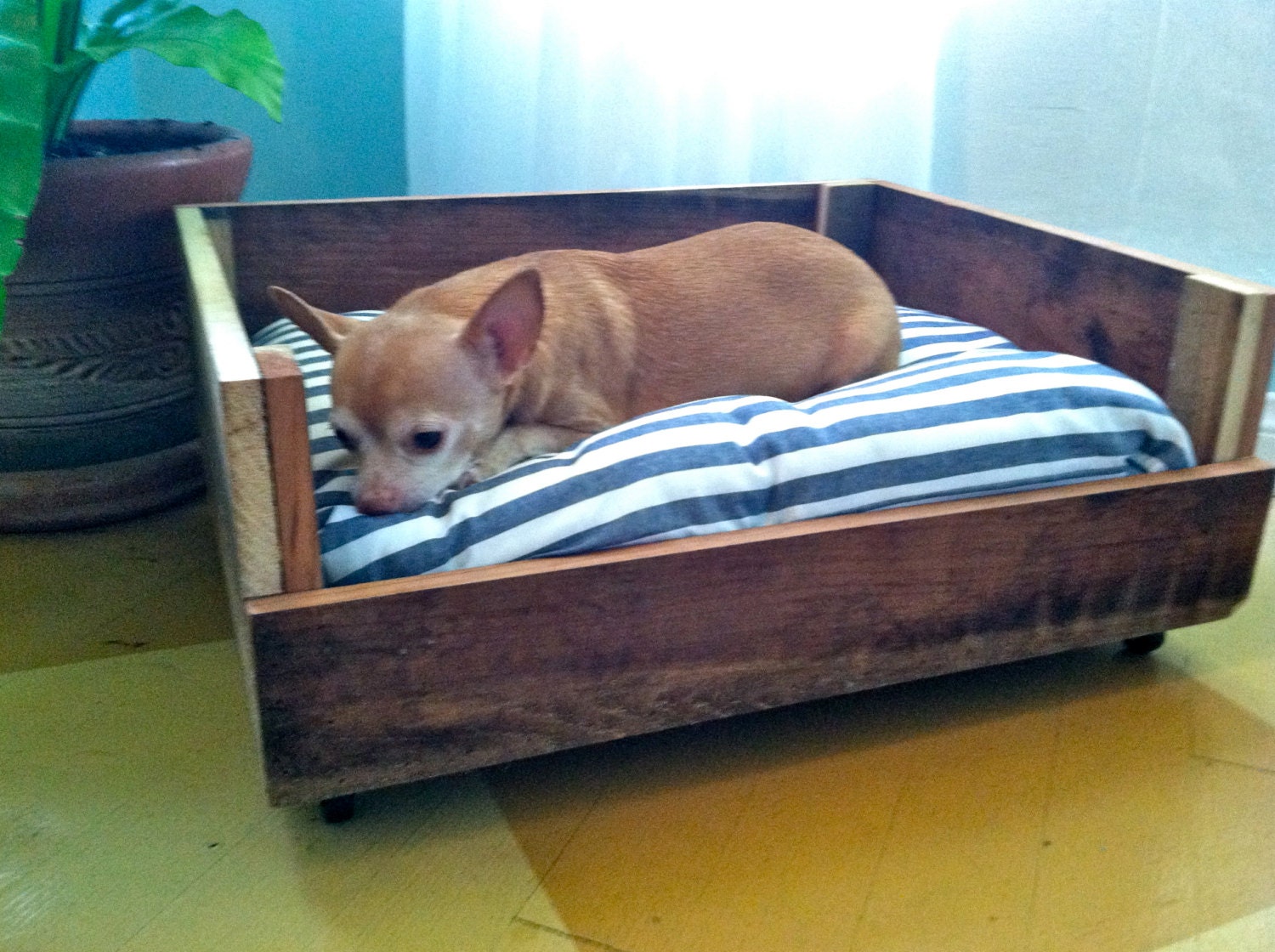 Pet Bed made out of reclaimed wood and vintage fabric.