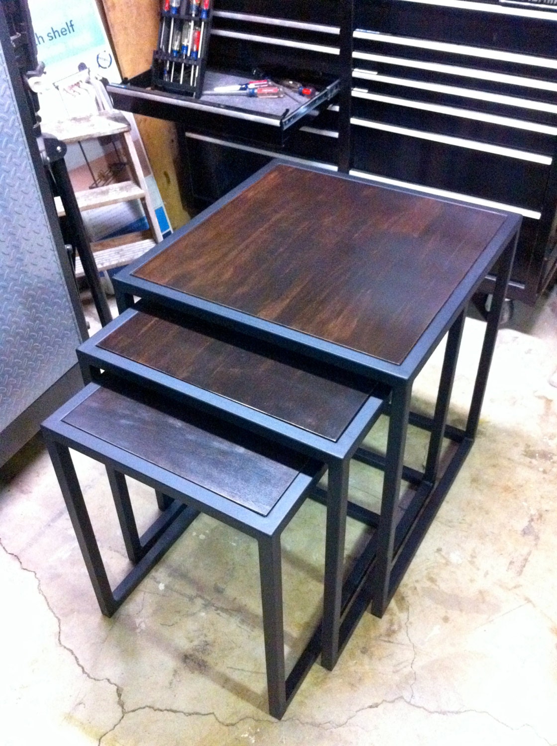 Handcrafted custom metal framed nesting tables with stained wood top