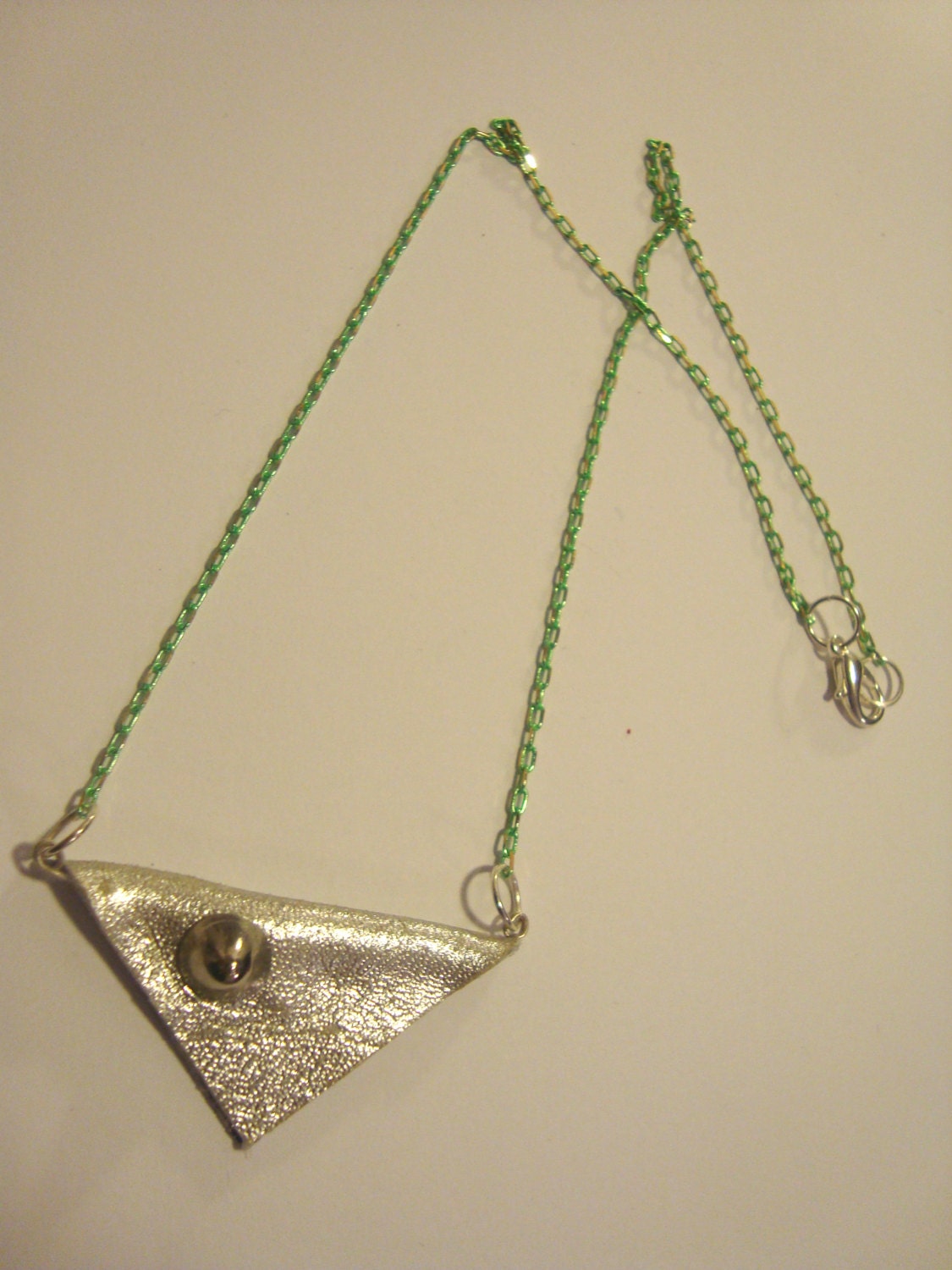 Geometric Silver triangular leather stud necklace on fluorescent  green brass chain