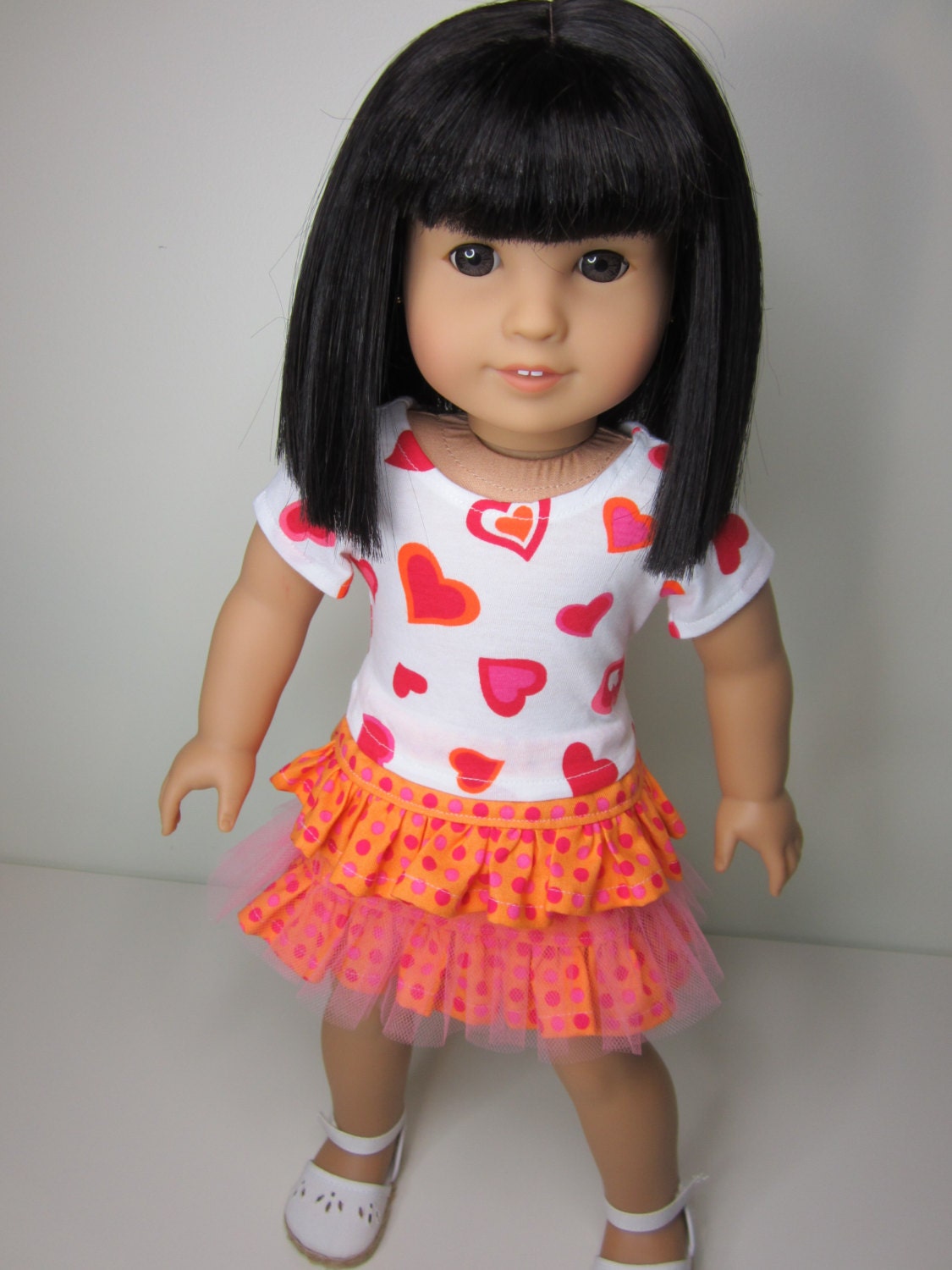 American Girl doll clothes- Bright and colourful summer outfit, ruffle skirt and tshirt with hearts in orange and pinks.