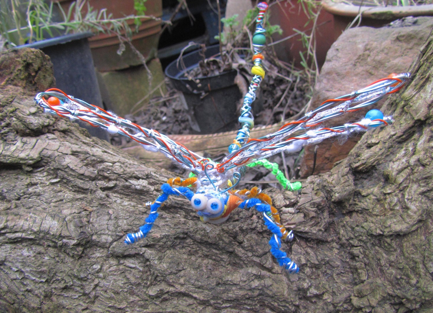 Upcycled dragonfly ornament, a colourful mixed-media eco-friendly friendly friend