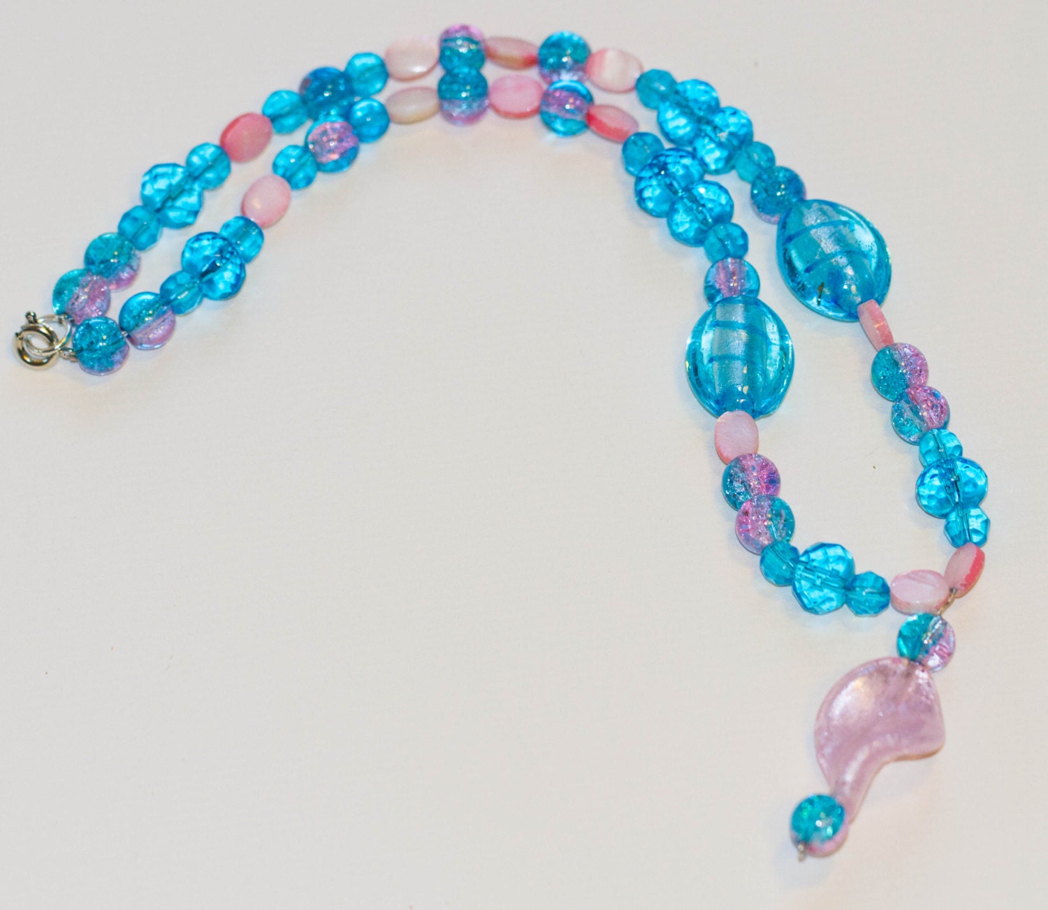 Pink and Blue: Glass and mother-of-pearl with beaded pendant