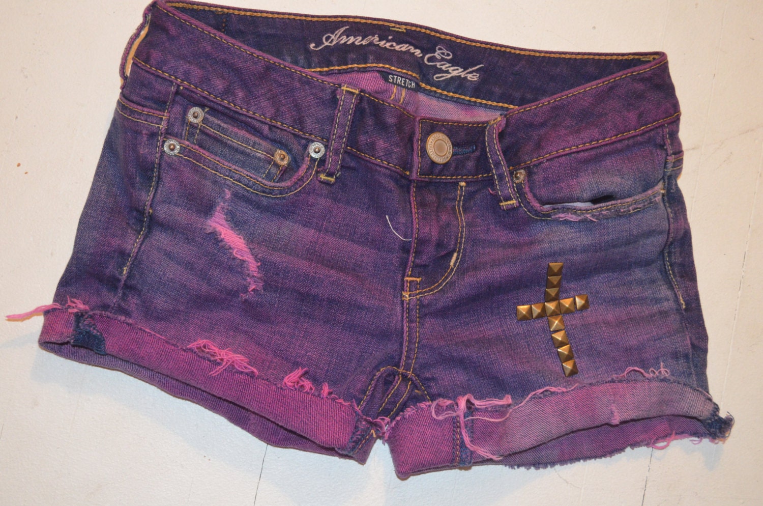 Purple Denim Shorts with bronze studded cross on leg