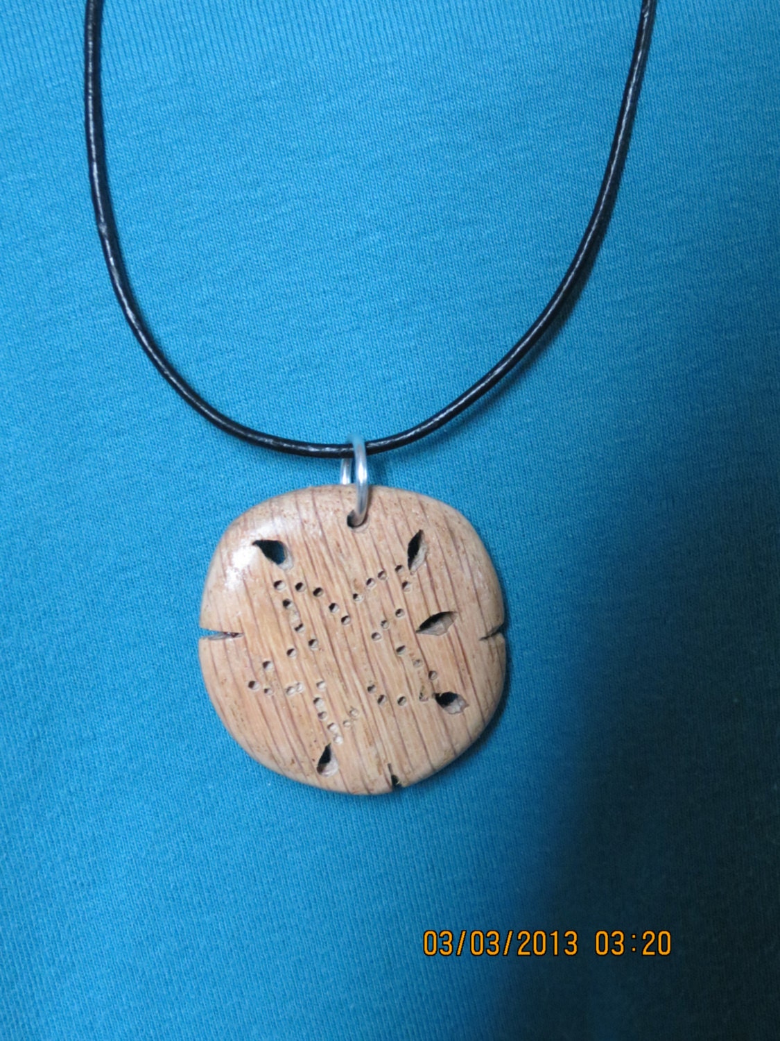 Wood Sand Dollar Necklace cut using scroll saw from red oak with 18 inch leather cord
