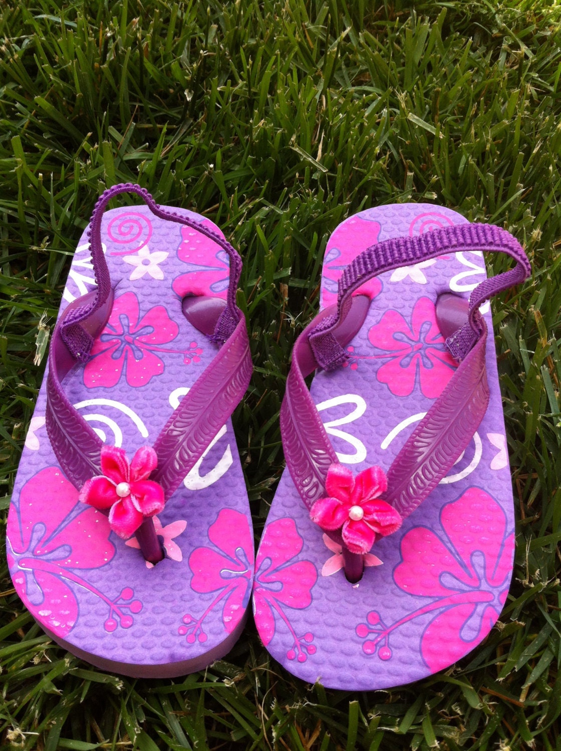 Adorable toddler flip flops embellished with velvet flower