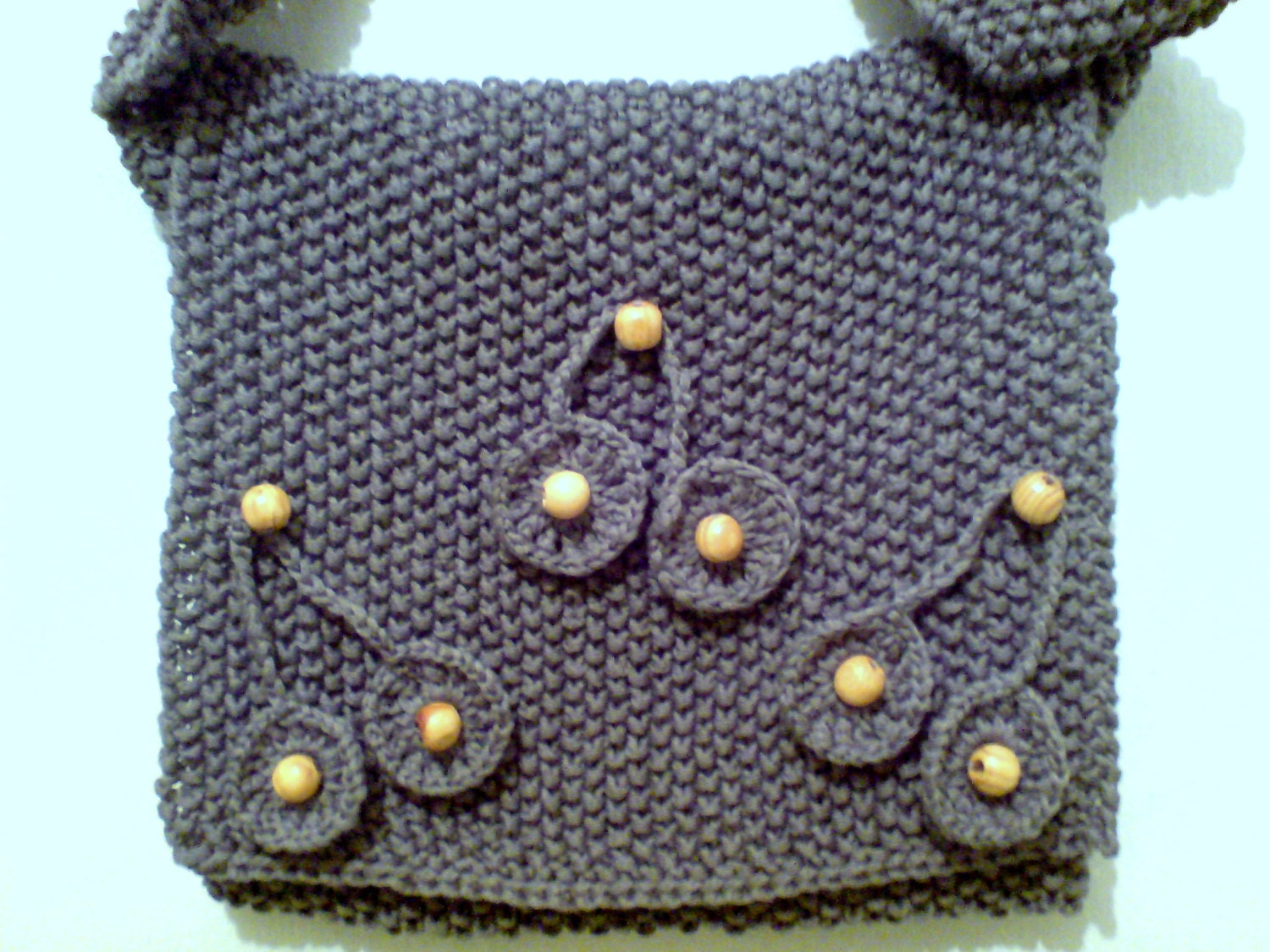 handmade, knit women messenger bag with crochet flowers on it.