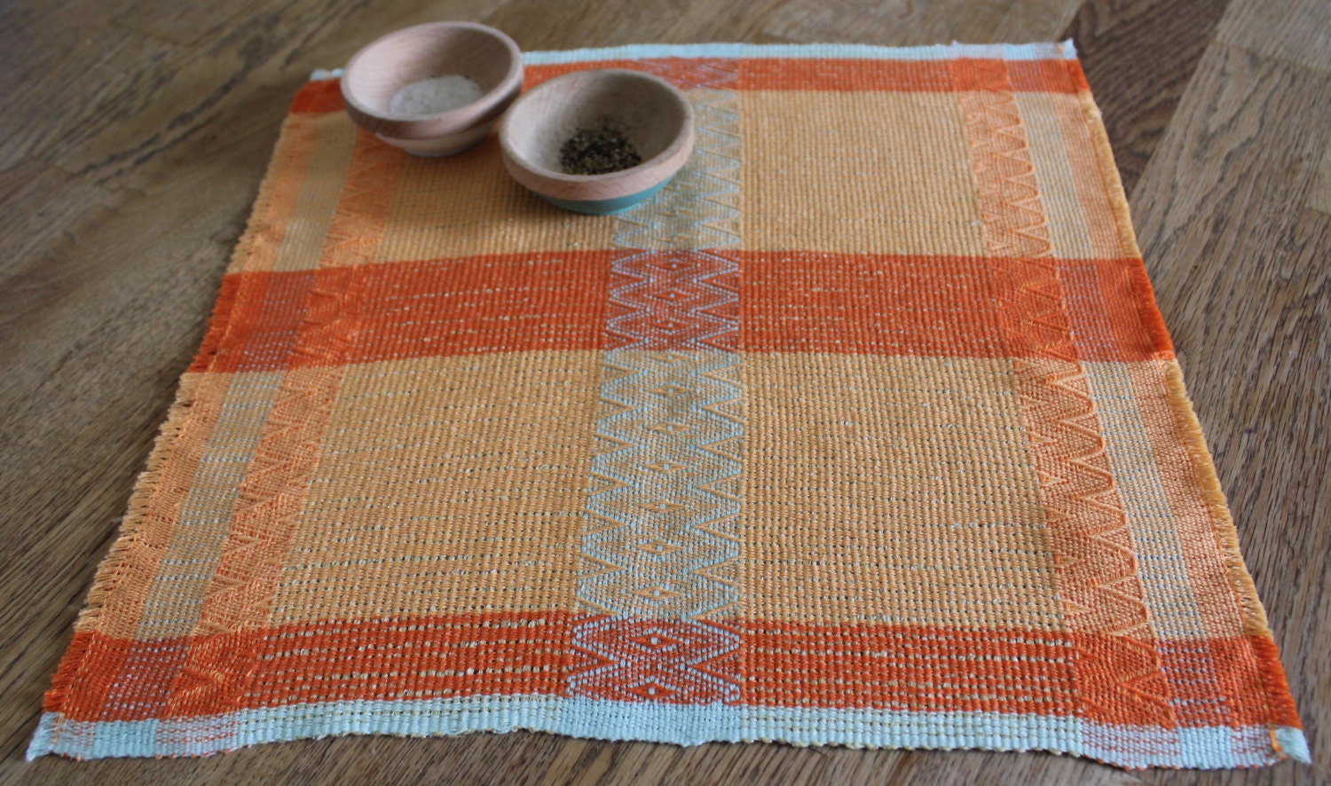 Hand woven decorative table mat.