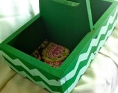 Wooden plant holder with handle.