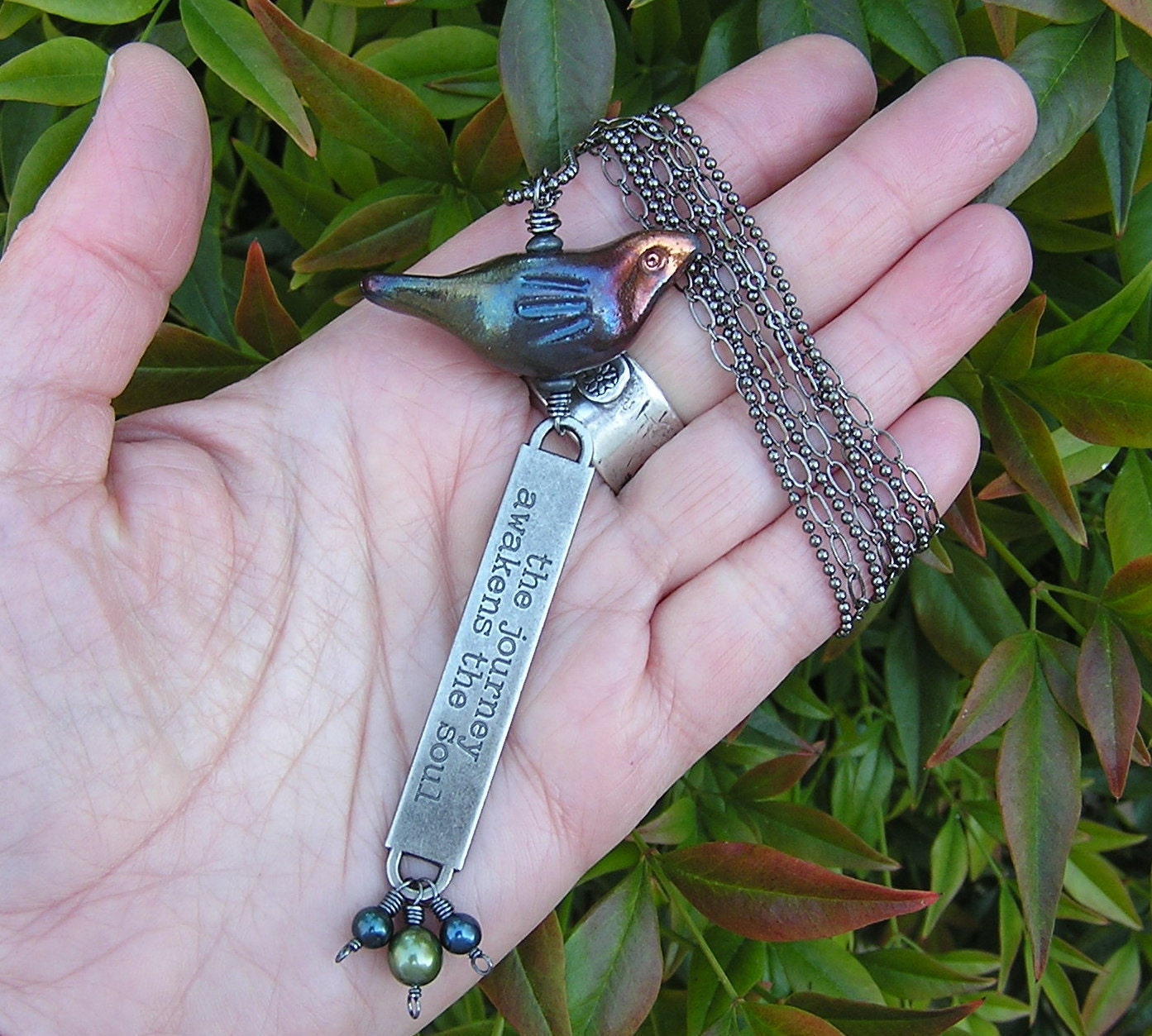 raku ceramic bird, freshwater pearls, and gunmetal pendant necklace. bird with stamped words. one of a kind long necklace