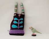 Purple textile art rabbit doll called Maude Muckle-lugs