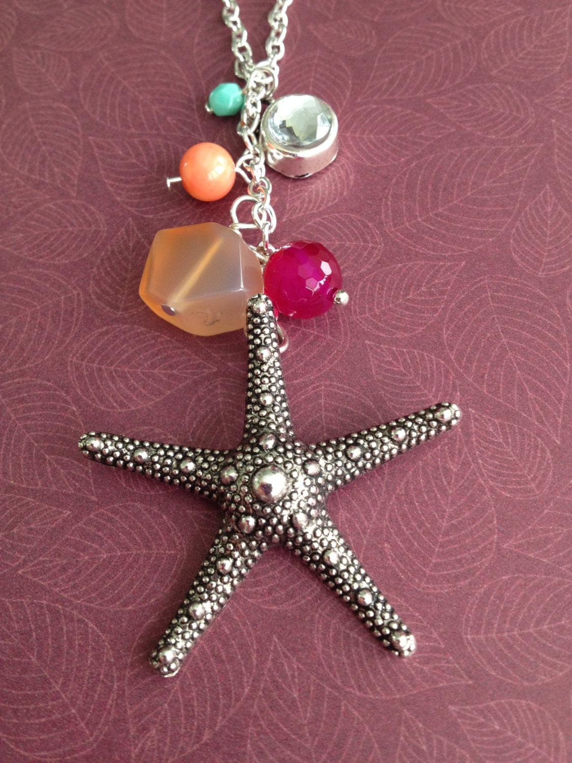 by the seashore. long charm necklace