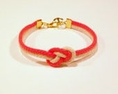Matte neon orange and natural beige infinity knot nautical rope bracelet with gold anchor charm