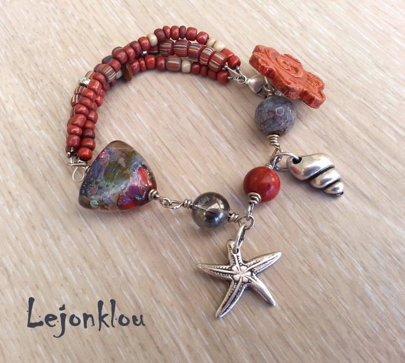 Dreams by the seaside  charm bracelet with stunning lampwork  ceramic and ancient style beads