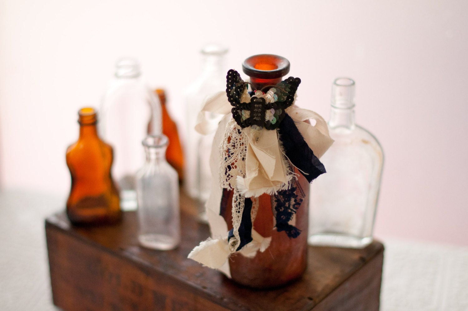 Antique glass bottle with moth,  table decoration, ivory and midnight blue