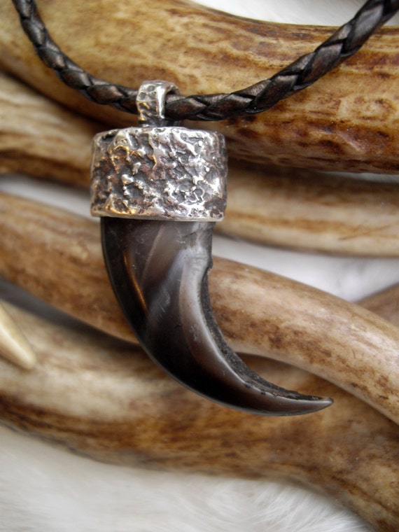 genuine bear claw set in a silver cap pendant by inthegate