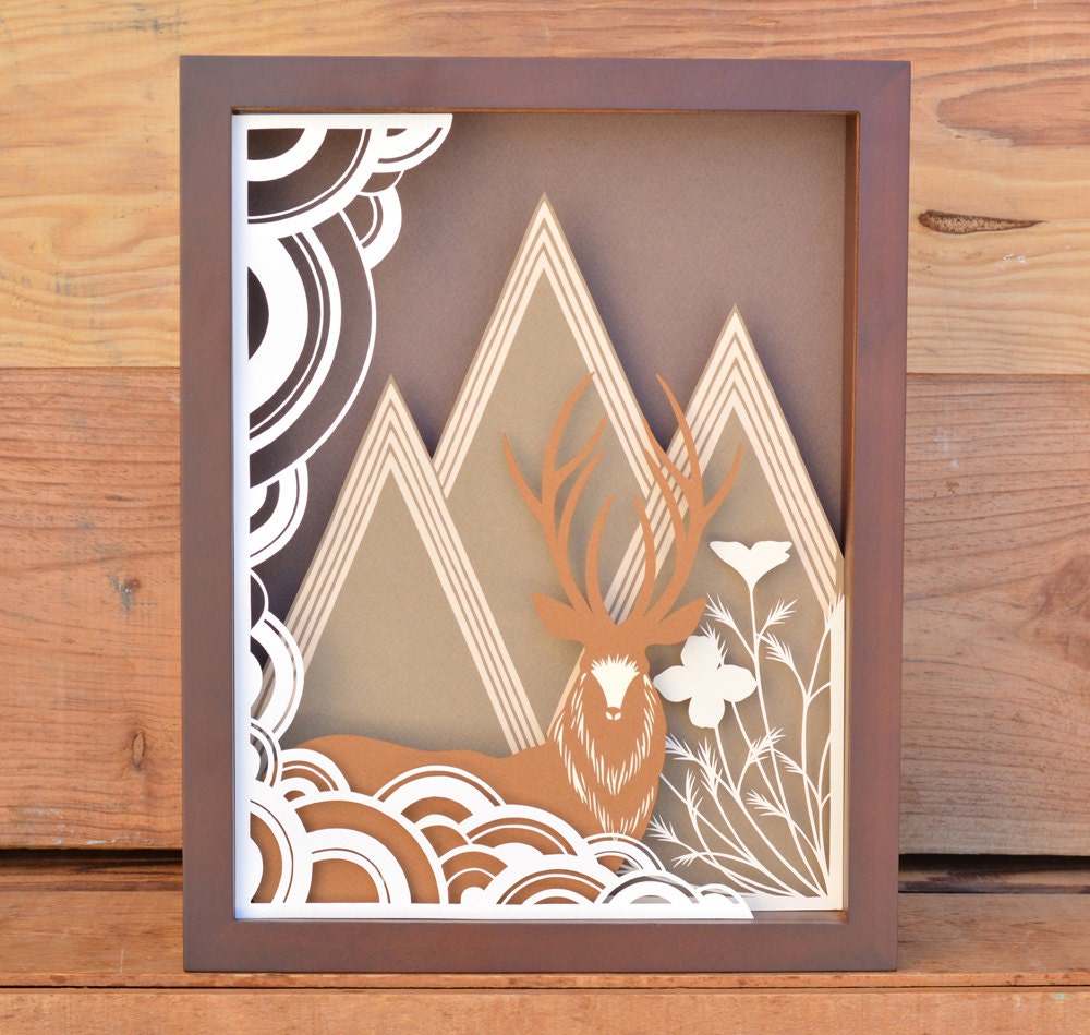 stag and mountain range . 8.5 x 11 . cut paper shadow box . deer, mountains, clouds, poppies